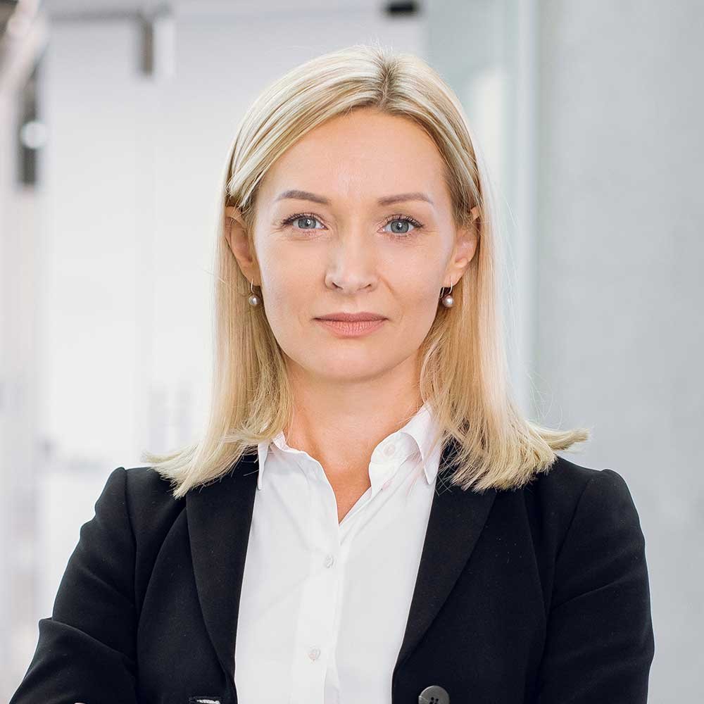 indoor-office-portrait-of-pretty-mature-blond-busi-PAPVH57.jpg